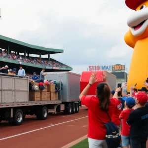 Crowd at Phillies Truck Day event with trailers loaded with baseball gear